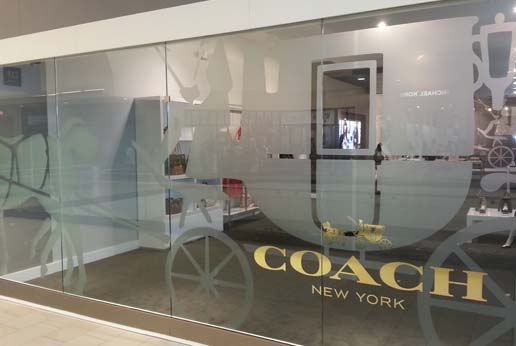 coach new york storefront window branding